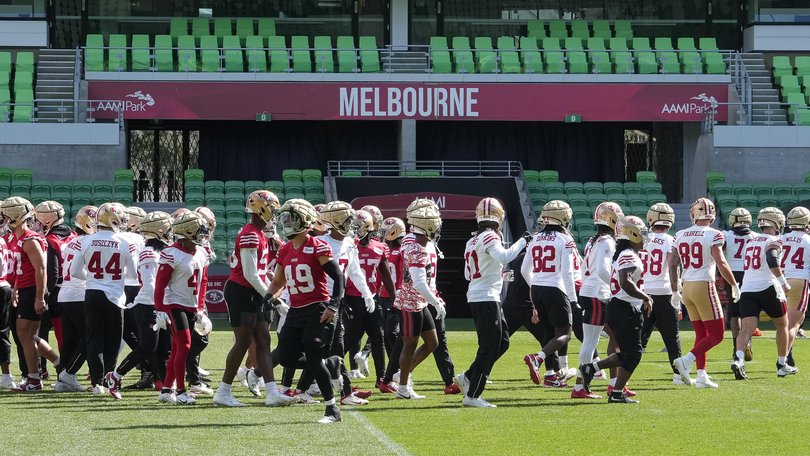 San Francisco 49ers players work out during a practice.