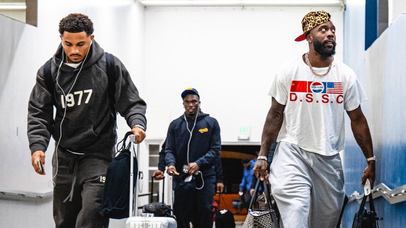 Los Angeles Rams players Trent McDuffie and Jaylen Watson touch down in Melbourne. 