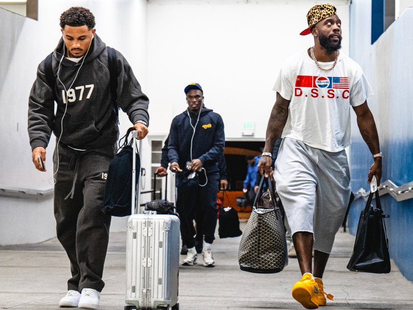 Los Angeles Rams players Trent McDuffie and Jaylen Watson touch down in Melbourne.