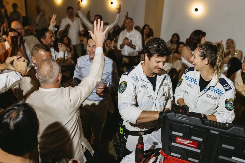 The elated groom celebrating after officers freed him from his husband’s ring.