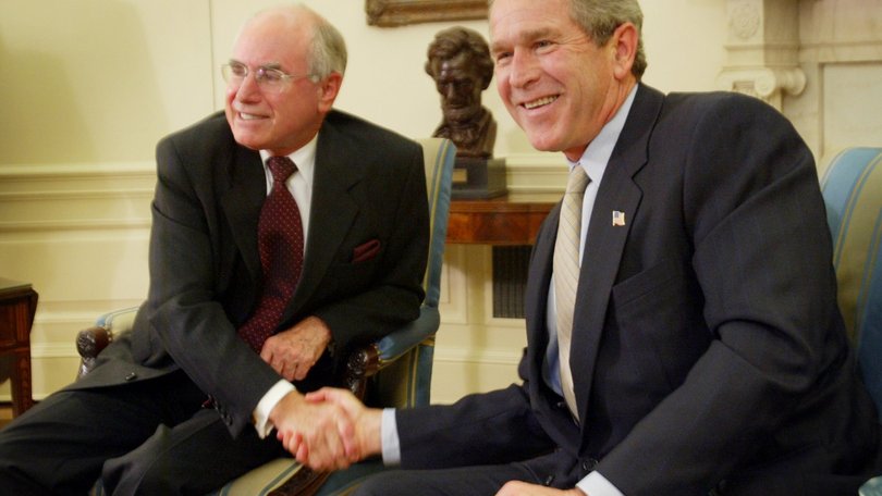 President George Bush Junior, right, greets Australian prime minister John Howard during their meeting in the Oval Office at the White House, Feb. 10, 2003 in Washington
