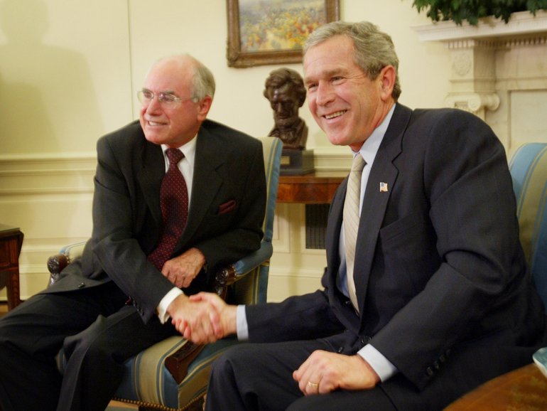 President George Bush Junior, right, greets Australian prime minister John Howard during their meeting in the Oval Office at the White House, Feb. 10, 2003 in Washington