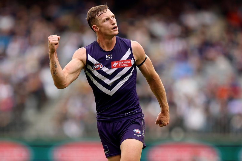 Josh Treacy of the Dockers celebrates a goal.