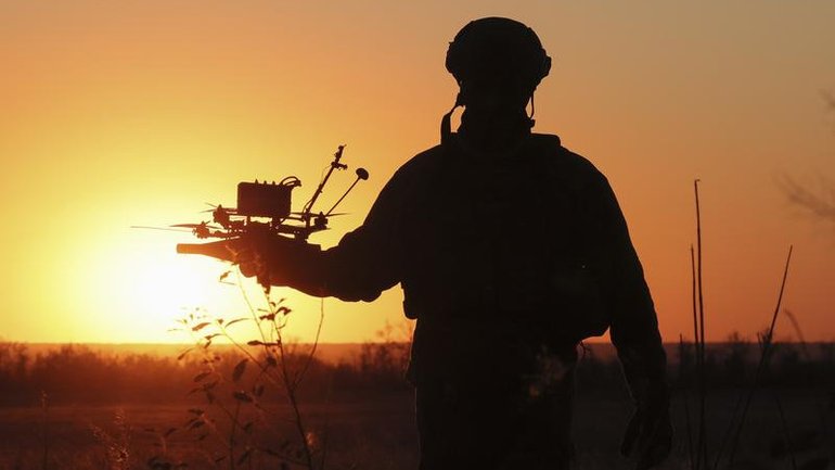 A Ukrainian soldier with a military drone.