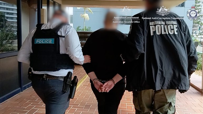ATO employee charged over alleged organised crime leaks, child abuse material.