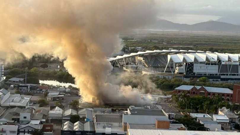 Smoke seen billowing from the Great Northern Hotel in Townsville on Friday.