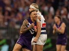 Shai Bolton of the Dockers celebrates a goal by charging into Bailey Smith.