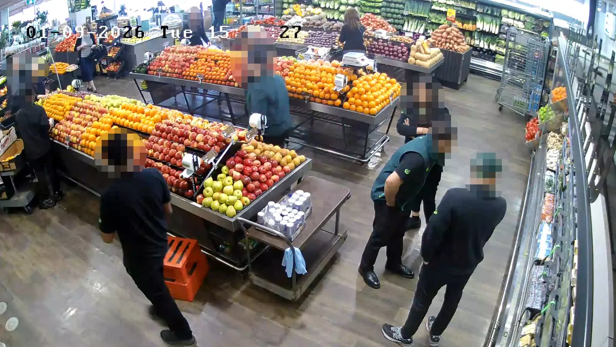 Woolies staff storm IGA in bizarre act caught on CCTV