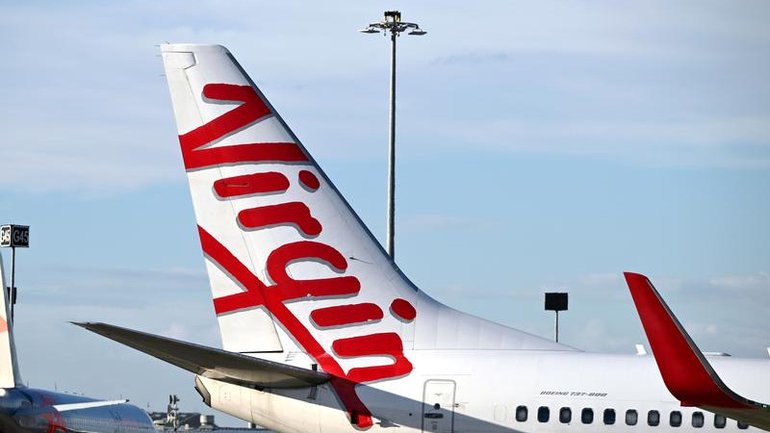 Mid-air horror as men restrained on Virgin flight from Melbourne.