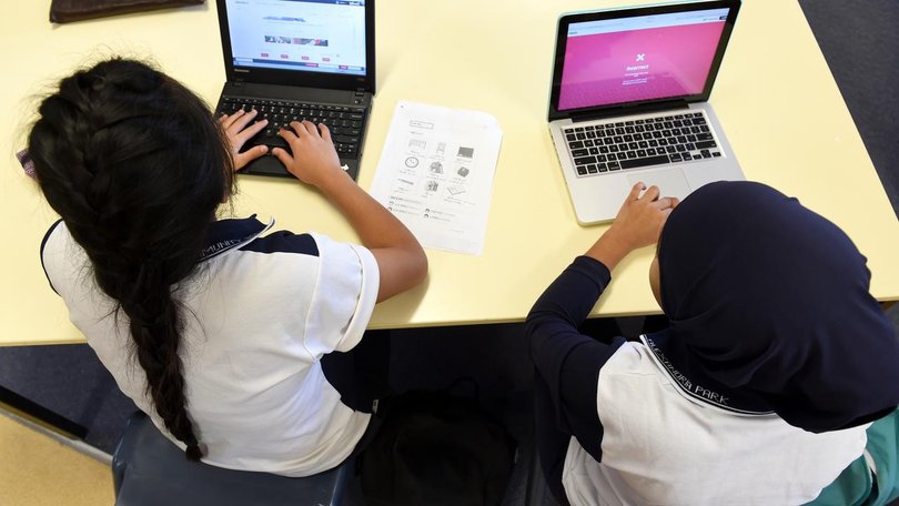 A state will limit classroom screen time in a bid to address a drop in literacy and numeracy skills. (Paul Miller/AAP PHOTOS)
