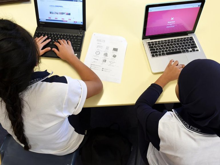 A state will limit classroom screen time in a bid to address a drop in literacy and numeracy skills. (Paul Miller/AAP PHOTOS)