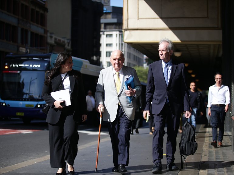 Alan Jones (C) arrives at the Downing Centre in Sydney.
Christian Gilles / NewsWire
