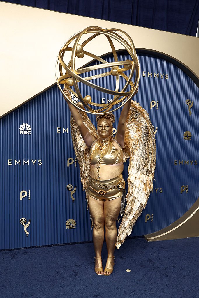 Megan Stalter attends the 78th Primetime Emmy Awards in head-to-toe gold.
