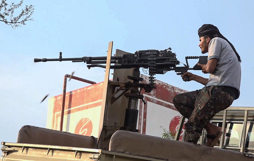 This frame grab taken from AFPTV video footage on September 9, 2026, shows a member of the Saudi-backed Yemeni government forces firing a heavy machine gun during clashes with Houthi fighters in the Al-Kadha area. The strait has become an increasingly important route for Saudi oil since Iran blockaded the Strait of Hormuz, choking Gulf exports. (Photo by AFPTV / AFP) /