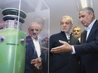 In this photo released by the Iranian Presidency Office, President Masoud Pezeshkian, second right, listens to head of Atomic Energy Organization of Iran Mohammad Eslami as he visits an exhibition of Iran’s nuclear achievements, in Tehran, Iran. (Iranian Presidency Office via AP, File) (AP PHOTO)
