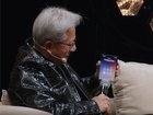 A screengrab from the All-In Summit Podcast shows Jensen Huang answering the call from President Donald Trump.