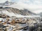 Aman Rosa Alpina is huddled beneath the pale limestone ramparts of the Dolomites.