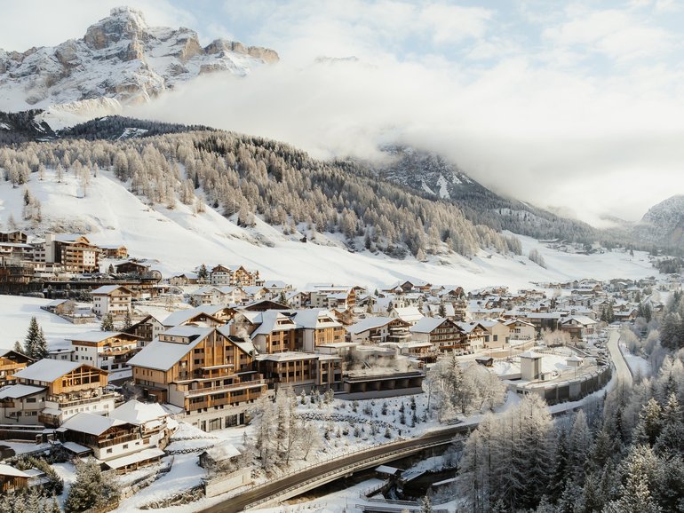 Aman Rosa Alpina is huddled beneath the pale limestone ramparts of the Dolomites.
