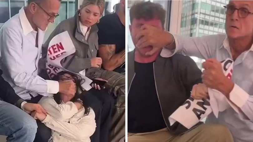 Viral footage shows the fashion boss wrapping his arms around one protestor and dragging her to the floor with another clip showing him grabbing another protestor by the face to to stop them from shouting.
