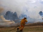 Firefighters are battling a blaze burning in extreme weather conditions on the outskirts of Darwin. (Dean Lewins/AAP PHOTOS)