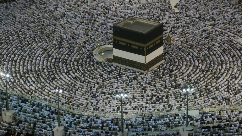 Muslim pilgrims praying at the Grand Mosque, in the Muslim holy city of Mecca, Saudi Arabia.