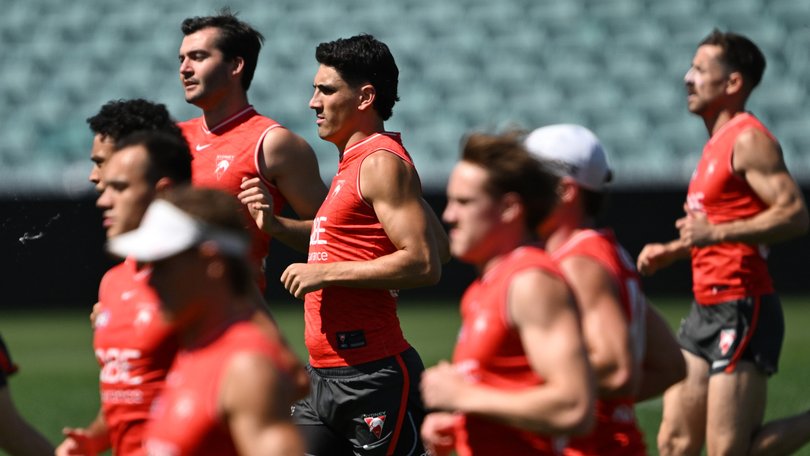 Justin McInerney (centre) at Swans training this week.