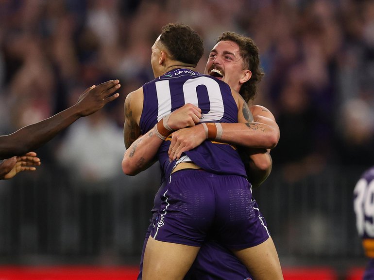 Luke Jackson and Shai Bolton of the Dockers celebrate winning the AFL semi-final.