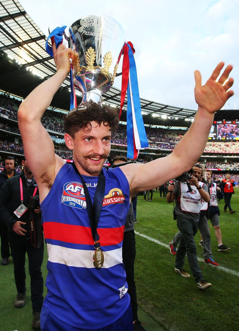 Tom Liberatore of the Bulldogs celebrate the win with the cup during the 2016 Toyota AFL Grand Final.