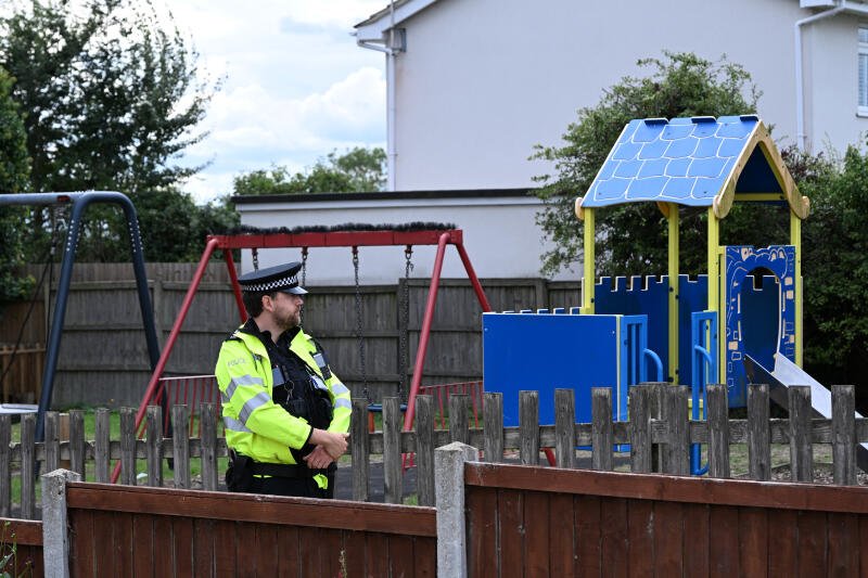A police officer at a playground in Merriam Close Brantham