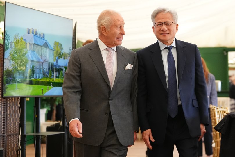 King Charles III walks with Nvidia chief executive Jensen Huang to a meeting for leaders from the artificial intelligence (AI) sector at Dumfries House.