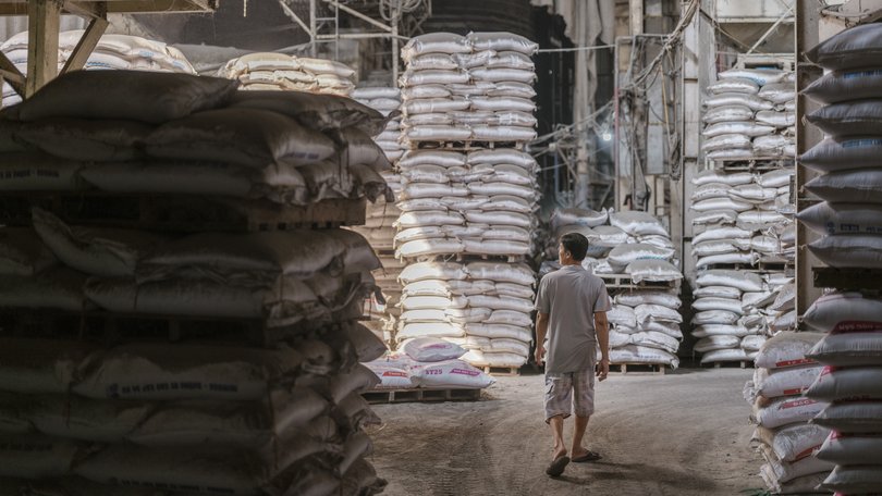 A worker checks storage at a factory in Vietnam. Inflation in Asia projected to reach 5.2 per cent this year.