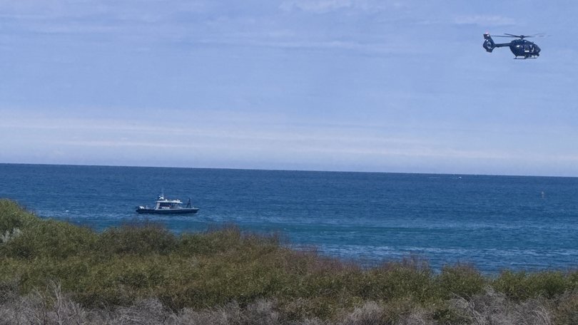 Emergency services have dispatched helicopters and water police to the beach.