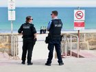 Emergency services have dispatched helicopters and water police to the beach. 