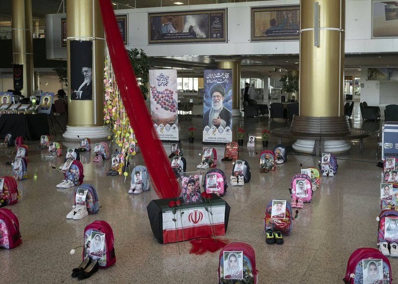 A display commemorating the deaths of children in an airstrike on an elementary school is seen on Wednesday, July 8, 2026, at the airport in Mashad, Iran.