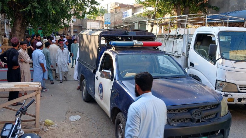 Security officials stand guard near the scene of a bombing at a mosque in Kohat, Pakistan. (EPA PHOTO)