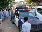 Security officials stand guard near the scene of a bombing at a mosque in Kohat, Pakistan. (EPA PHOTO)