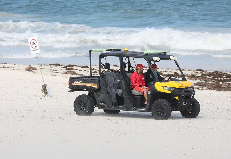 Authorities patrol the beach today.