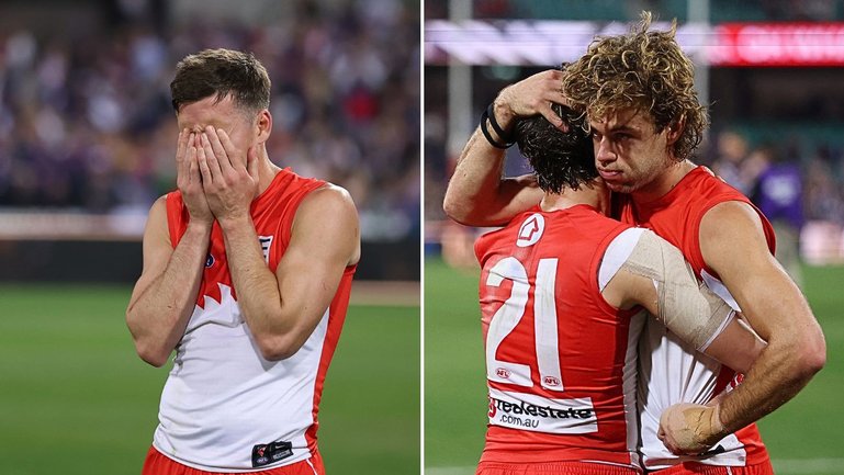 Shattered Swans players after the preliminary final loss to Fremantle.