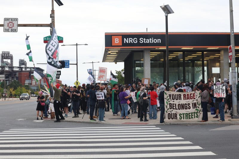 Pro-Palestinian demonstrators gather outside the Ed Sheeran concert.