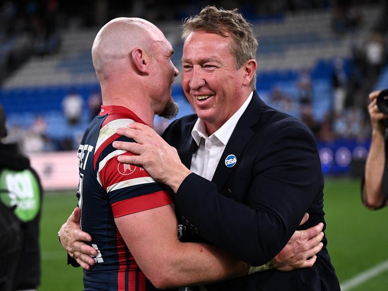 Angus Crichton of the Roosters is embraced by head coach Trent Robinson following their win in the NRL Semi Final between the Sydney Roosters and the Cronulla-Sutherland Sharks at Allianz Stadium in Sydney, Saturday, September 19, 2026. (AAP Image/Dan Himbrechts) NO ARCHIVING, EDITORIAL USE ONLY DAN HIMBRECHTS
