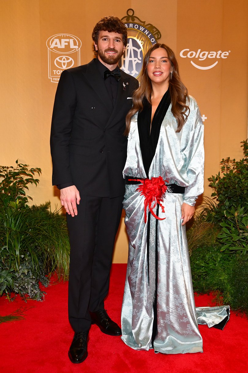 VARIOUS CITIES, AUSTRALIA - SEPTEMBER 21: Marcus Bontempelli (c) of the Western Bulldogs and wife Neila Bontempelli arrive ahead of the 2026 Brownlow Medal at Crown Palladium on September 21, 2026 in Melbourne, Australia. (Photo by Quinn Rooney/Getty Images)