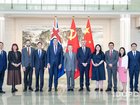 The Australian delegation poses before the  in Beijing. IDCPC