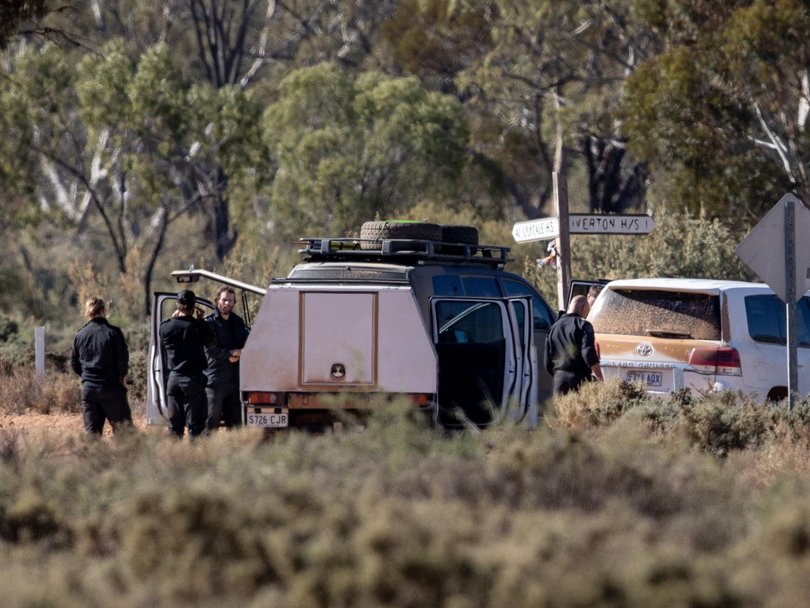 Police gather near Oak Park Station where the search continues for four-year-old Gus Lamont, who was last seen on 27 September 2025.