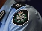 Australian Federal Police officers have arrested a man  accused of being an Islamic State operative. (Jono Searle/AAP PHOTOS)
