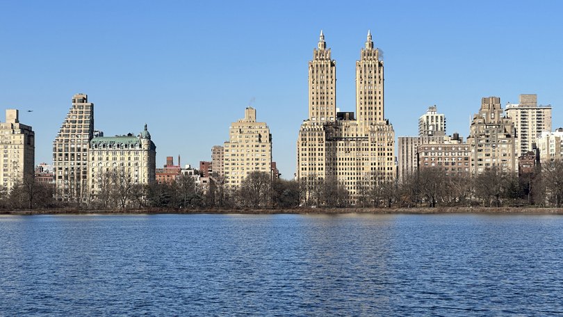 New York seen across the reservoir in Central Park, New York.