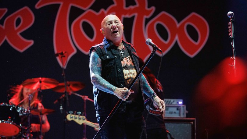 Australian rock legend Angry Anderson is in hospital after suffering a cardiac arrest, with his Rose Tattoo bandmates asking fans to keep him and his family in their thoughts.