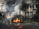 Ukrainian rescuers extinguish a fire in an office building following an air attack on  Kyiv on Wednesday.