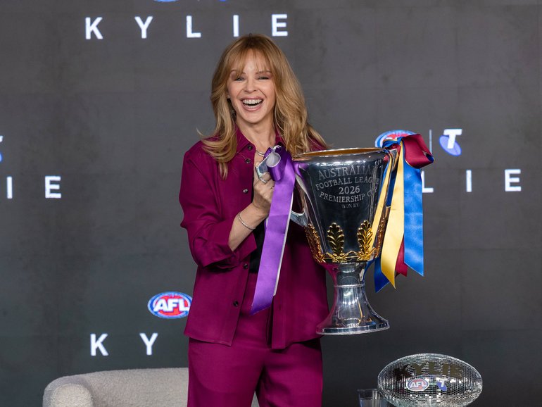 Kylie Minogue with the premiership cup. 