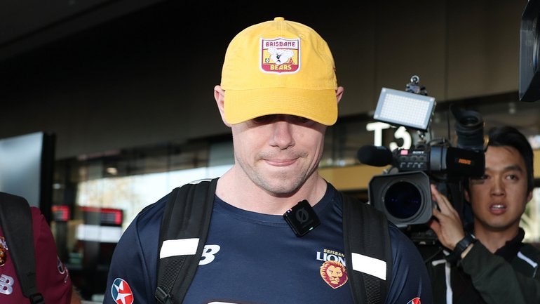 Lachie Neale of the Lions arrives at Melbourne Airport.