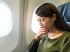 A woman who reported a man masturbating while staring at her says she was forced back into the seat beside him — before he was allowed to walk off the plane.